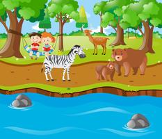 Niños y animales junto al río. vector