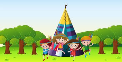 Children playing red indians in park vector