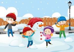 Niños felices jugando en la nieve vector