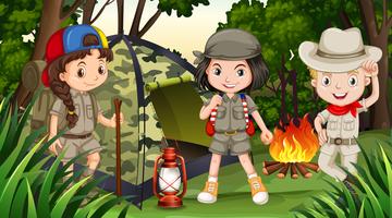 Children camping in the deep forest vector