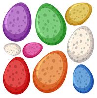 Huevos de dinosaurio de diferente color. vector