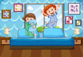 Two girls in pajamas jumping on bed vector