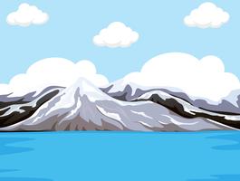 Mountain next to the water vector