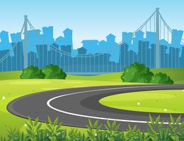 Road and park with city buildings in background vector