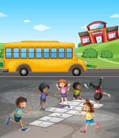 School campus with students playing in the field vector