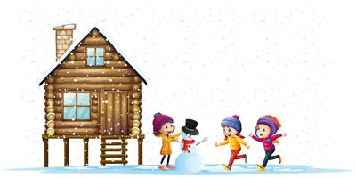 Niños jugando en la nieve junto a la choza. vector