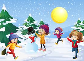 Niños jugando en la nieve en navidad vector