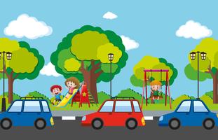 Escena con niños en parque infantil y coches en la carretera. vector