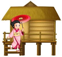 Chica japonesa en la choza de bambú. vector