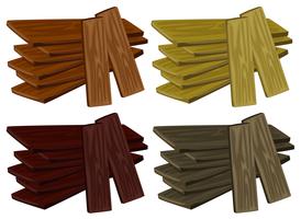 Four piles of wood in different colors