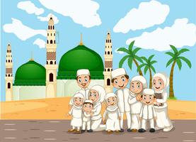 A muslim family in front of mosque vector