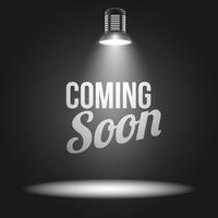 Coming soon message illuminated with light projector vector