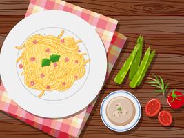 Spaghetti and soup on the table vector