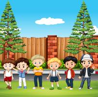 Many kids standing in the park vector