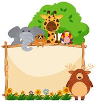 Wooden frame with wild animals in garden vector