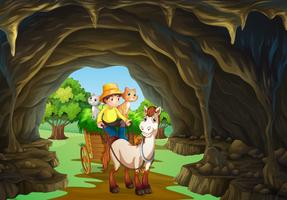 Man riding wagon through the cave vector