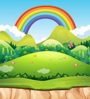 Un paisaje de montaña y arco iris vector