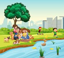 Family picnic next to duck pond vector