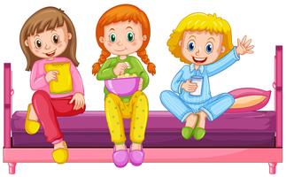 Three girls pajamas sitting on bed vector