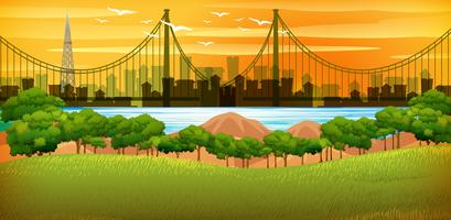 Background scene with city at sunset vector