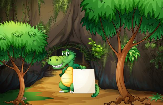 A crocodile holding an empty paper outside the cave 