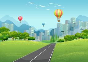 City scene with balloons and tall buildings vector