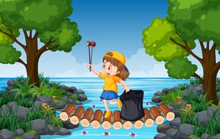 A Girl Collect Trash in Nature vector