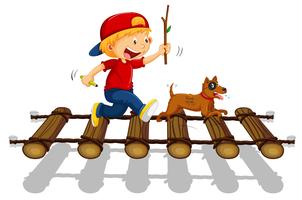 Boy and dog running on the bridge