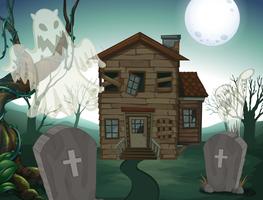 Haunted house and graveyard at night vector