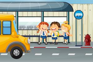 Three students waiting for bus at bus stop vector