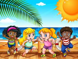 Four happy kids by the sea vector