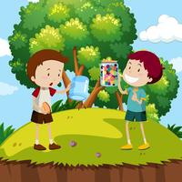 Two boys with colorful marbles in the park vector