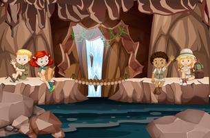 Camping kids in the cave vector