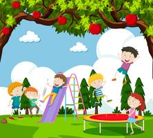 Children playing slide and bouncing on trampoline vector