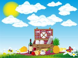basket for a picnic with tableware and foods on nature vector