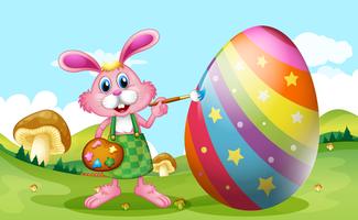 Happy Easter with bunny painting egg vector