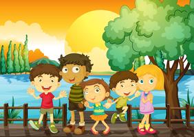 Children on the bridge at sunset vector