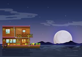 A boathouse floating in the middle of the night vector