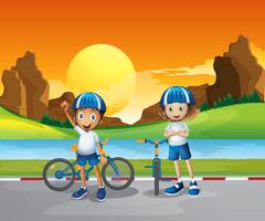 Two kids with their bikes standing at the road near the river vector