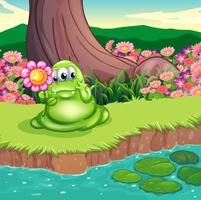 A green monster at the riverbank holding a flower vector