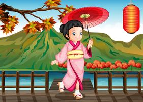 Una dama vistiendo un kimono rosa con un paraguas. vector