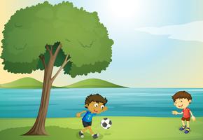 niños jugando al fútbol vector