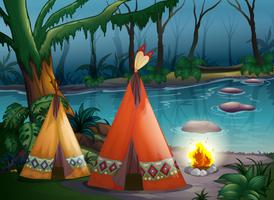 Traditional indian tents in the woods vector