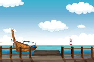 A docked boat and lighthouse vector