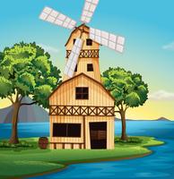 A farmhouse with a windmill vector