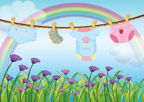 A child's clothes hanging above the garden vector