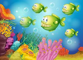 A group of green piranhas under the sea vector