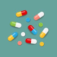 Pills in colors vector
