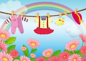 Baby clothes hanging in the garden vector