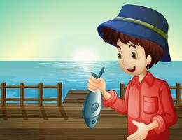 A fisherman holding a fish at the seaport vector